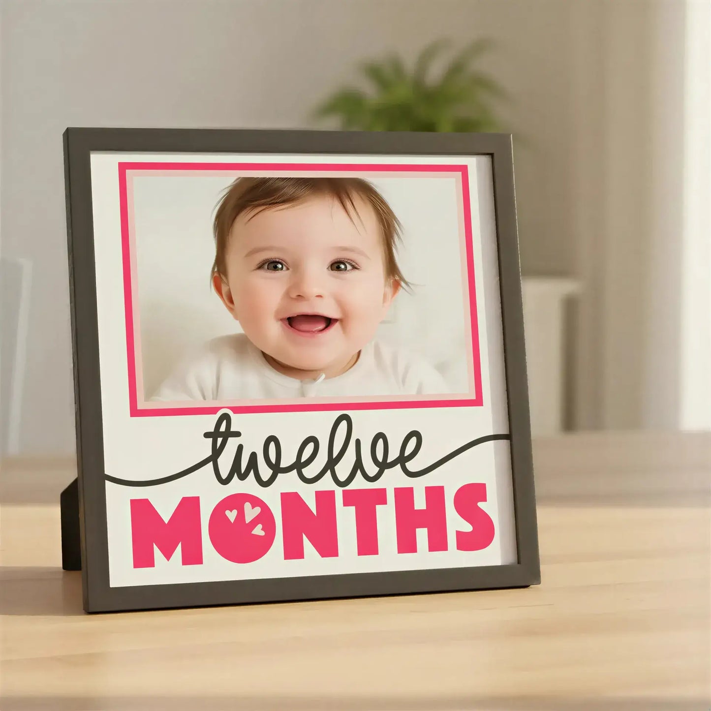 Decorative frame with 'twelve months' text and pink border on a white background