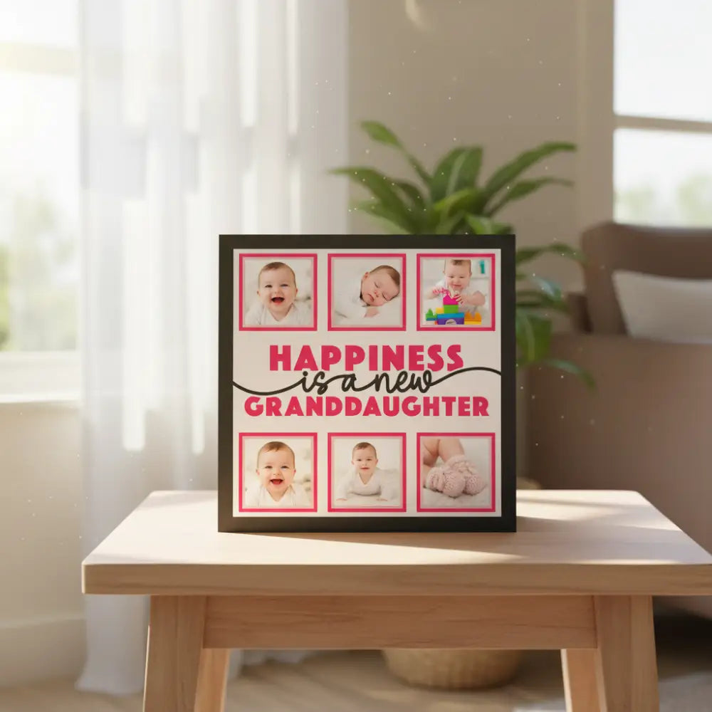 Decorative sign with 'Happiness is a new granddaughter' text and pink frames.