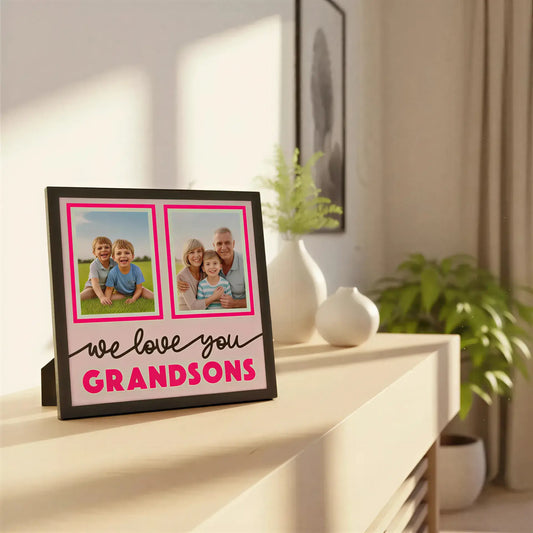 Design with two photo frames and text 'we love you GRANDSONS' on a pink background