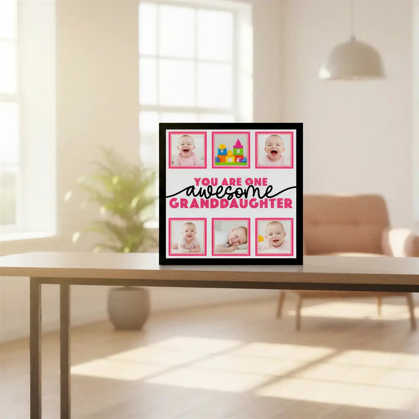 Decorative sign with 'You are one awesome granddaughter' text and pink frames.