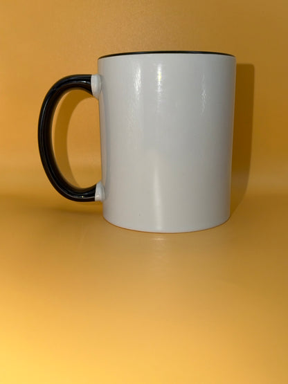 White mug with a black handle, shown from the side