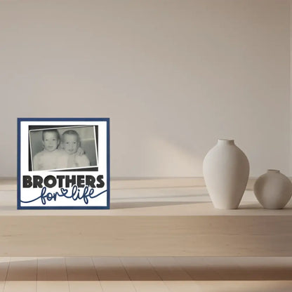 Black and white photo of two children with 'Brothers for Life' text