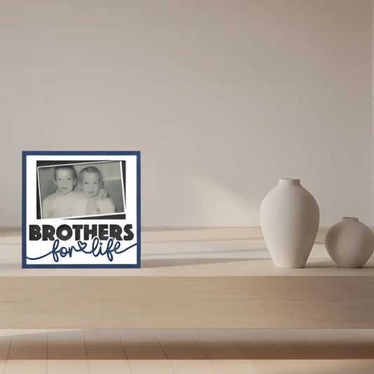 Black and white photo of two children with 'Brothers for Life' text
