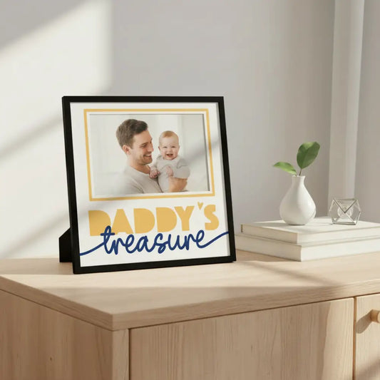 Decorative paper with 'Daddy's treasure' text and a gold border on a white background