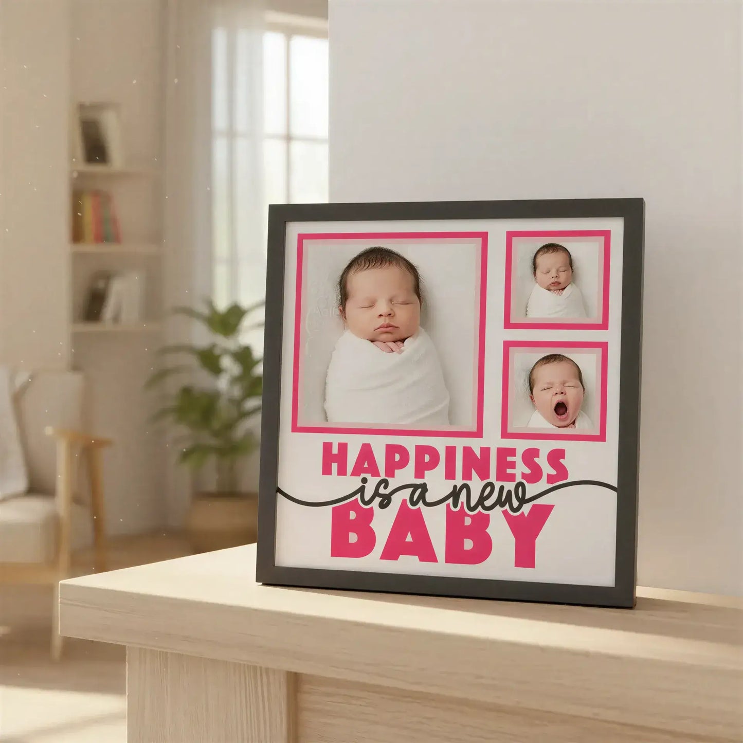 Decorative panel with text 'Happiness is a new baby' and pink frames on a white background.