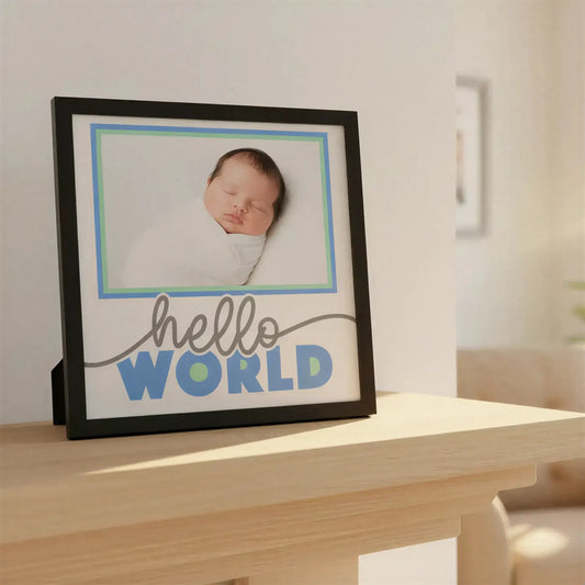 Framed artwork with 'hello WORLD' text in gray and blue on a white background