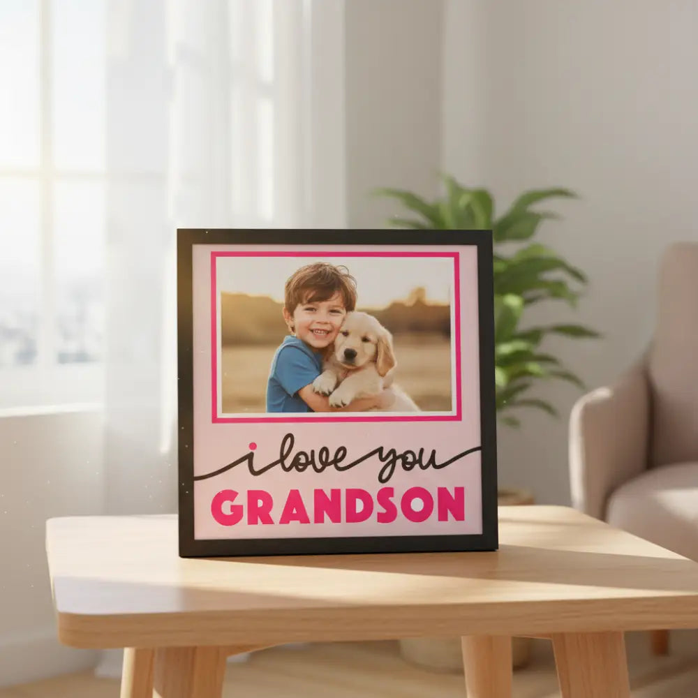 Decorative photo frame with 'I love you grandson' text on a pink background