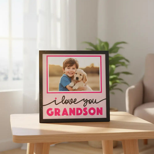 Decorative photo frame with 'I love you grandson' text on a pink background
