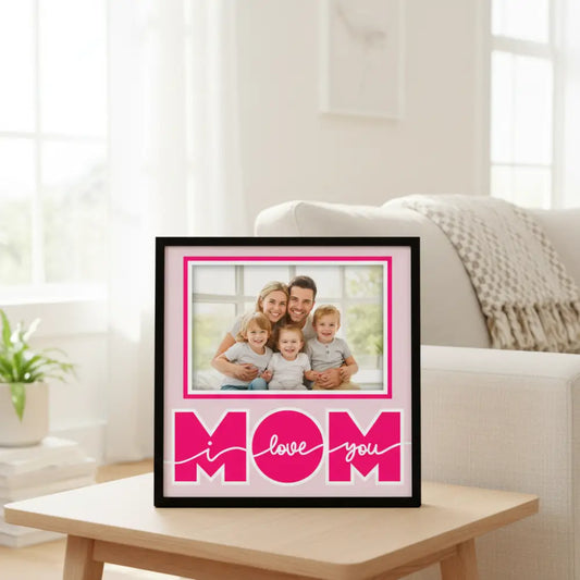 Pink 'I love you mom' text on a light pink background with a decorative border.