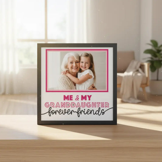 Decorative photo frame with text 'Me & My Granddaughter Forever Friends' on a white background.
