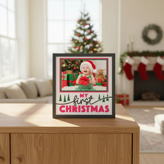 Decorative card with 'My First Christmas' text and Christmas trees on a white background.