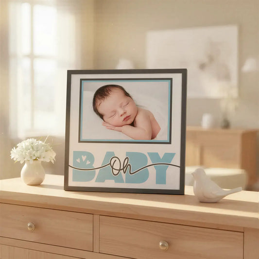 Design element with 'Oh Baby' text and a frame on a white background