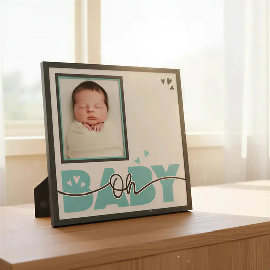 Baby-themed decorative item with a frame and 'Oh Baby' text on a white background.