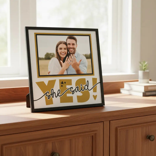 Decorative graphic with 'YES! she said' text in gold on a white background