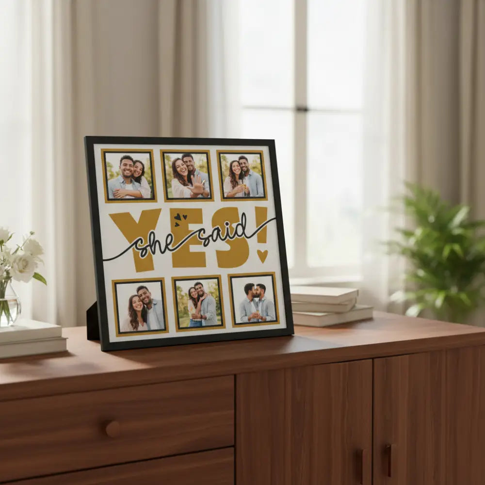 Decorative sign with 'YES! she said' text and gold frames on a white background