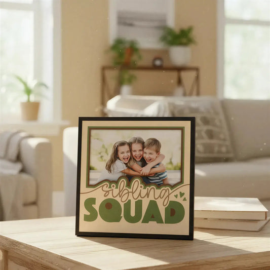 Decorative sign with 'Sibling Squad' text on a beige background