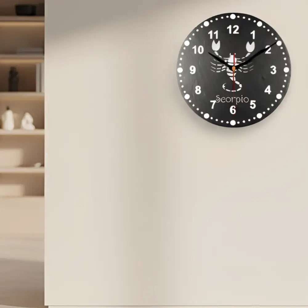 Decorative slate clock face with Scorpio zodiac symbol on a black background