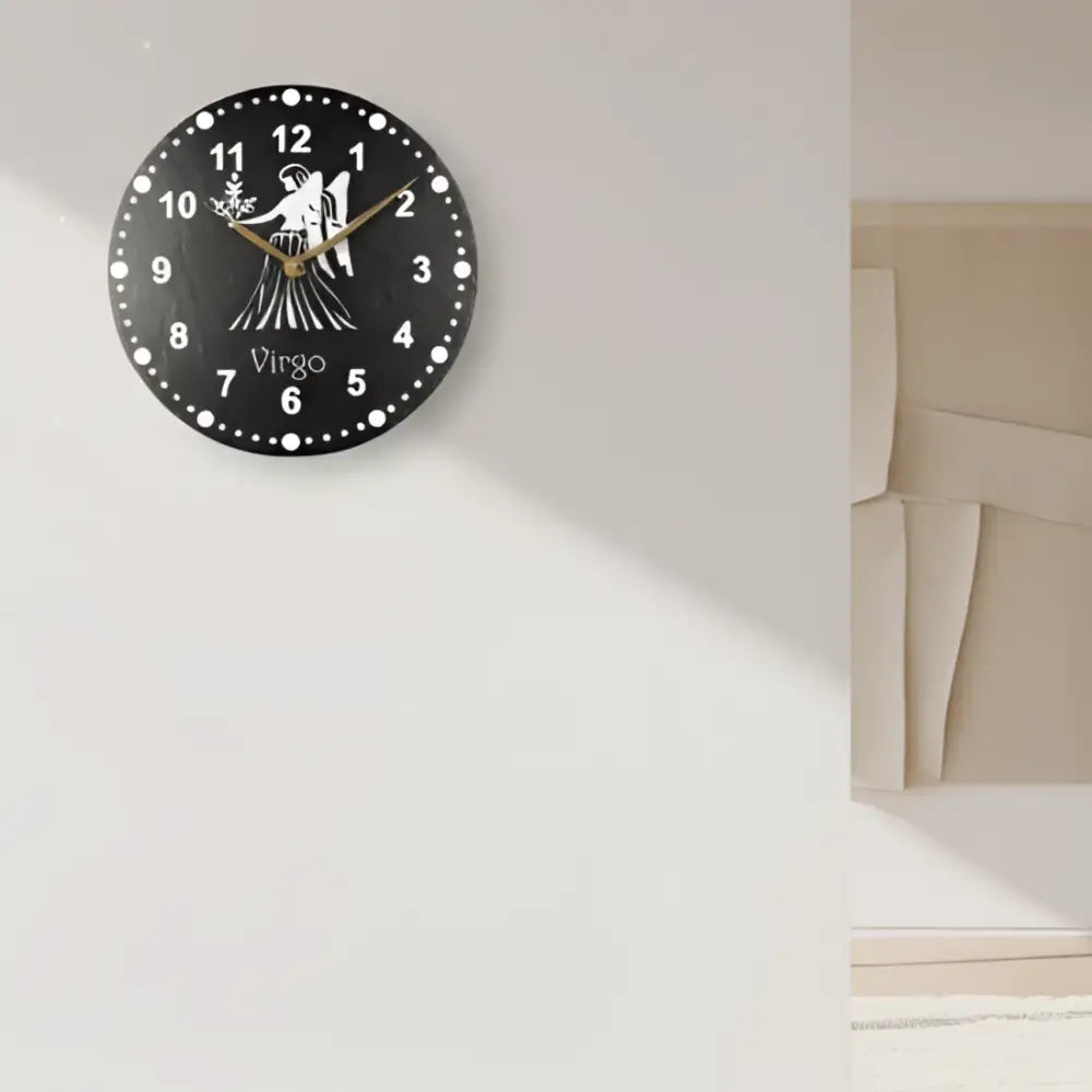 Decorative slate clock face with Virgo zodiac sign design on a black background