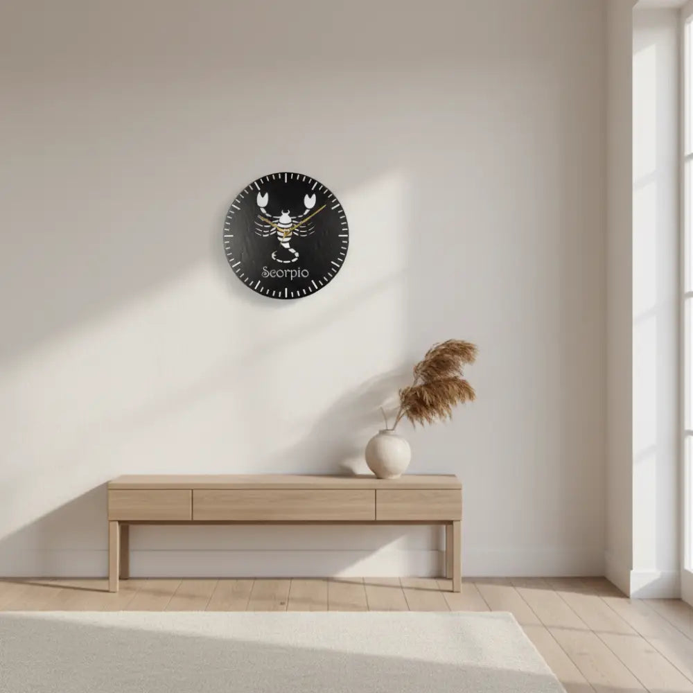 Slate clock with a white Scorpio zodiac symbol on a black background