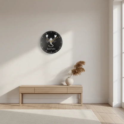 Slate clock with a white Scorpio zodiac symbol on a black background