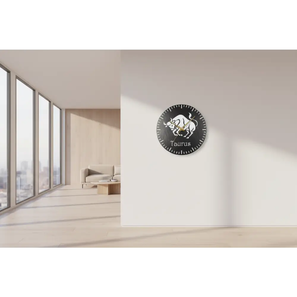 Wall clock with Taurus design on a wall in a modern room with large windows.