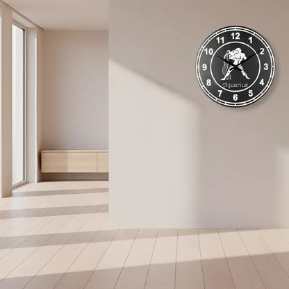 Decorative Slate clock face with Aquarius zodiac sign design on a black background