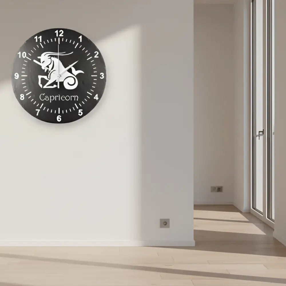 Round slate clock with Capricorn zodiac sign design on a grid background