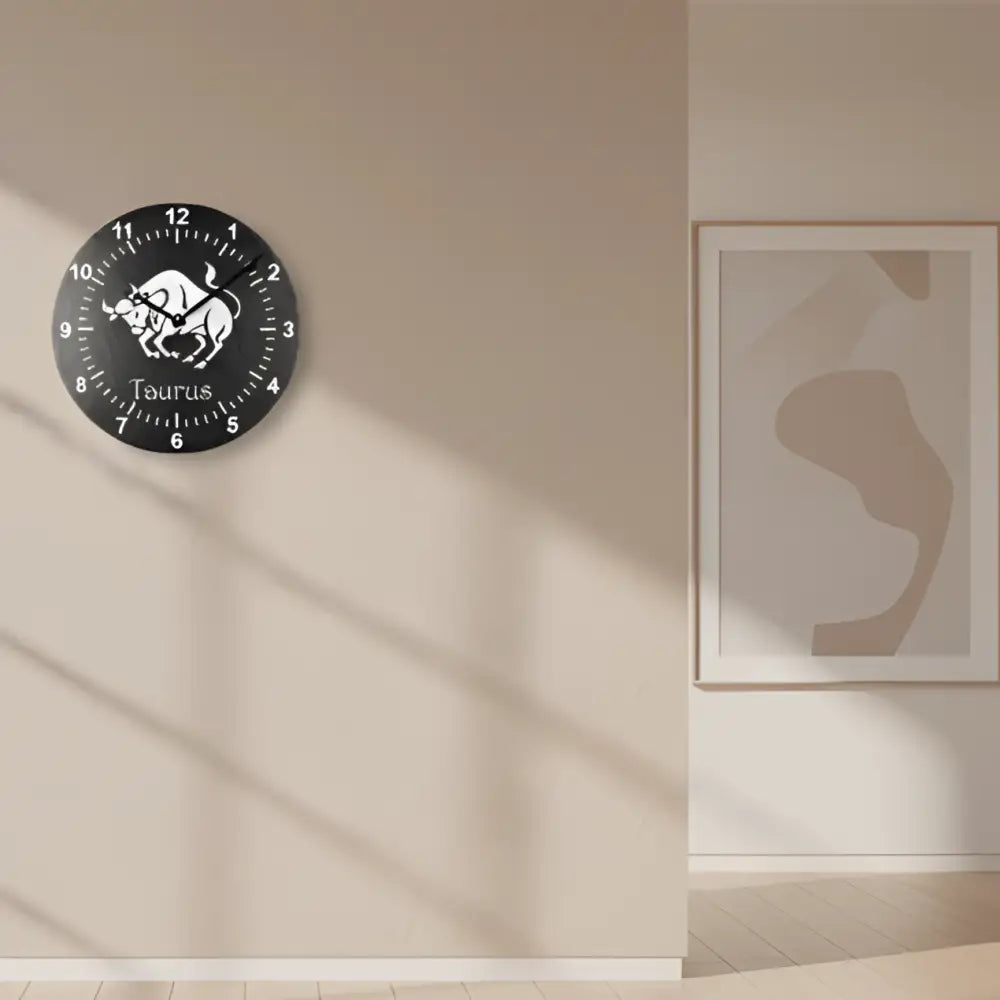 Slate Clock with Taurus zodiac sign design on a black background