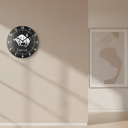 Slate Clock with Taurus zodiac sign design on a black background