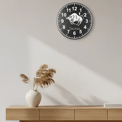 Round clock face with Taurus zodiac sign and numbers on a white background