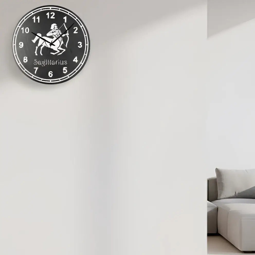 Sagittarius zodiac sign on a slate clock face with numbers 1 to 12.