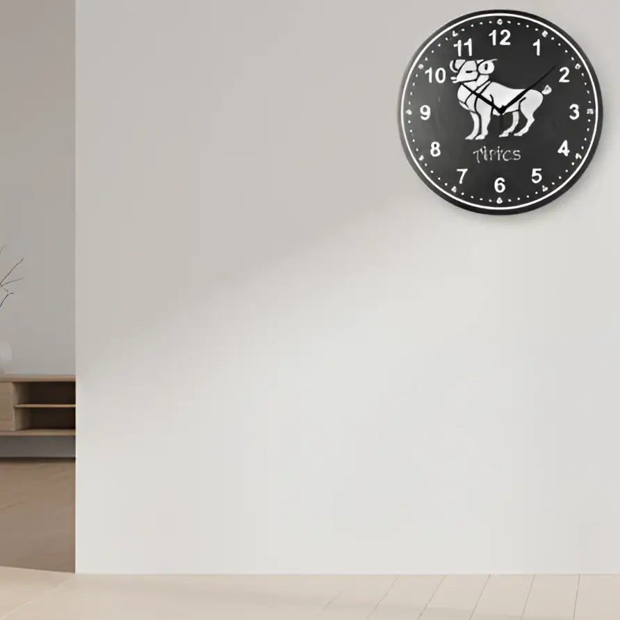 Slate clock with Aries zodiac sign and numbers on a dark background