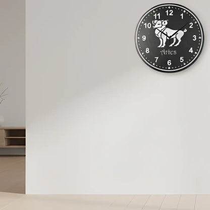 Slate clock with Aries zodiac sign and numbers on a dark background