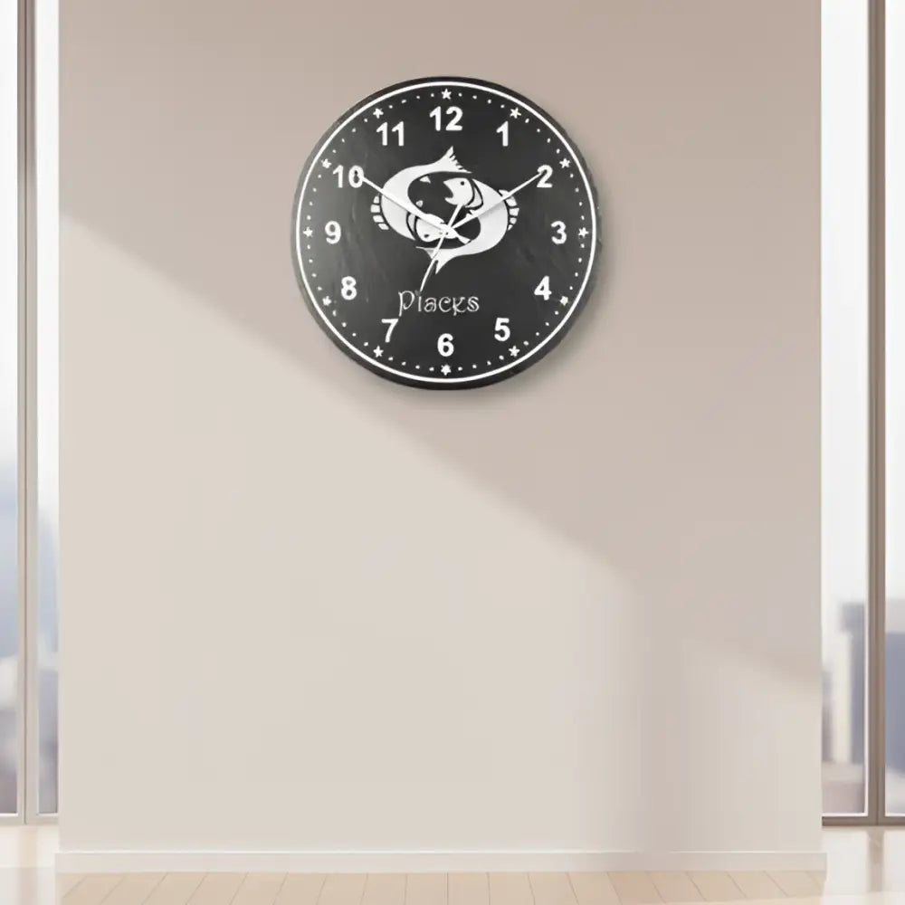 Pisces zodiac sign slate clock with star design on a black background