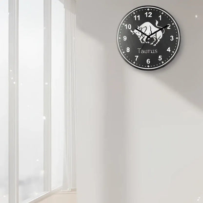Slate clock with Taurus zodiac sign on a tiled wall background