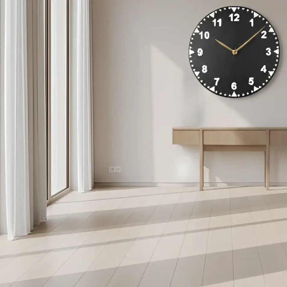 Slate clock face with white numbers on a dark background