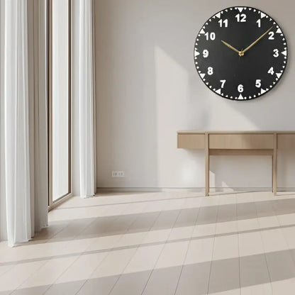 Slate clock face with white numbers on a dark background