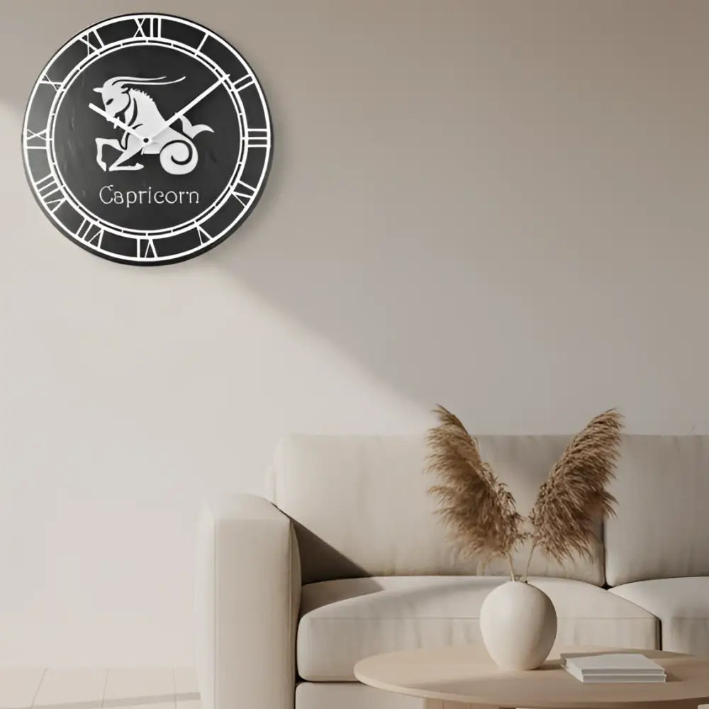 Capricorn zodiac sign in white on a dark circular slate background with Roman numeral border