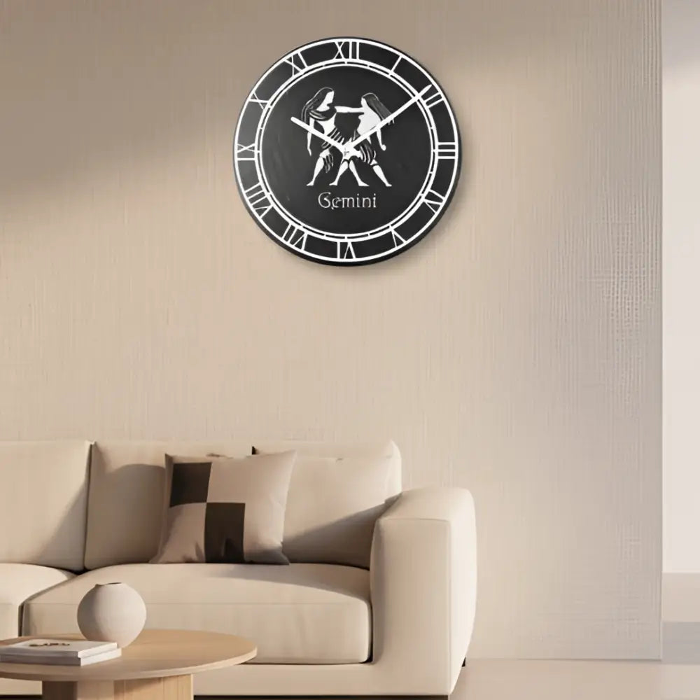 Decorative slate plate with Gemini zodiac sign design on a gray background