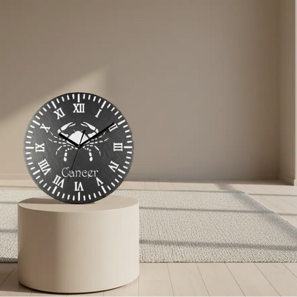 Decorative clock face with a crab design and 'Cancer' text on a black slate background.