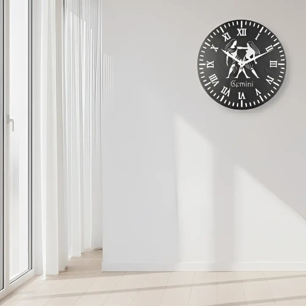 Decorative slate wall clock with Gemini zodiac sign design on a black background
