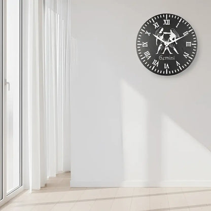 Decorative slate wall clock with Gemini zodiac sign design on a black background