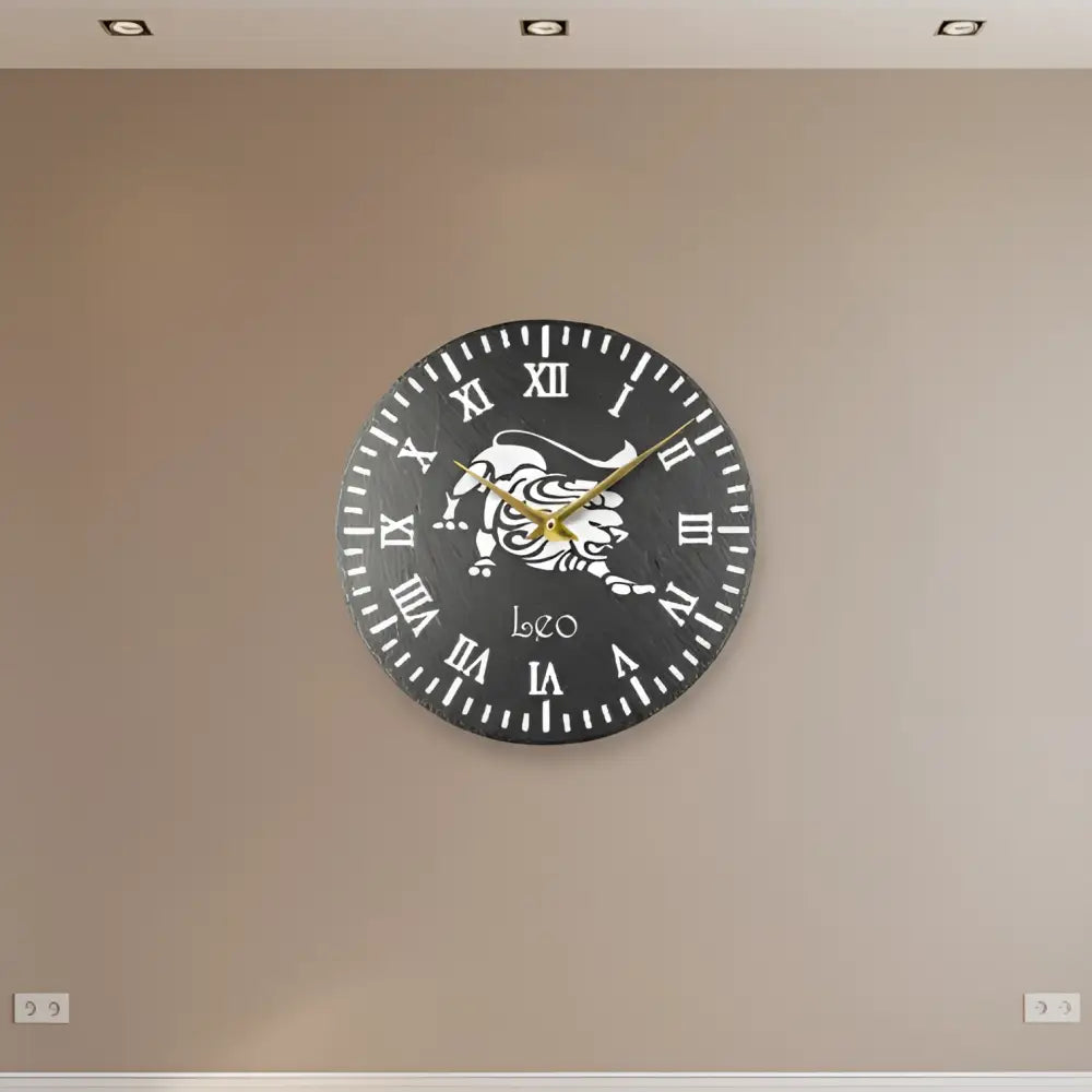 Decorative slate clock face with a lion emblem and Roman numerals on a black background