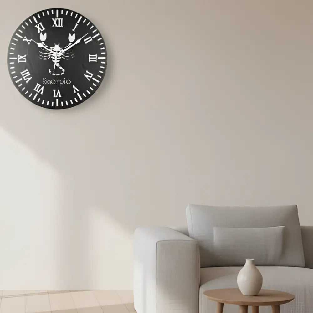 Decorative slate clock face with Scorpio zodiac symbol and Roman numerals on a black background