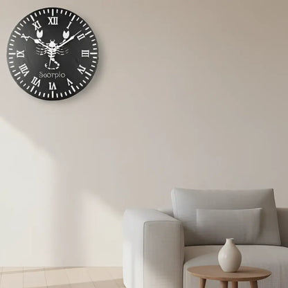Decorative slate clock face with Scorpio zodiac symbol and Roman numerals on a black background