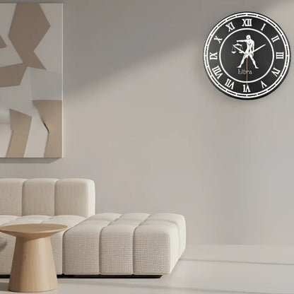 Libra zodiac sign with Roman numerals on a circular slate background