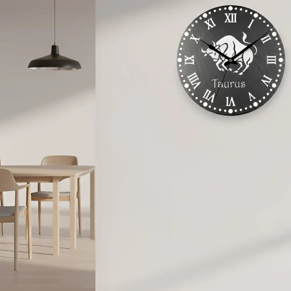 Taurus zodiac sign with Roman numerals on a circular slate background
