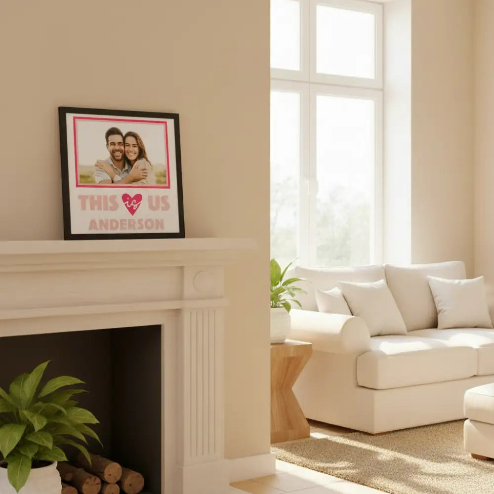 Framed print with 'This is Us' text and heart symbol on a white background