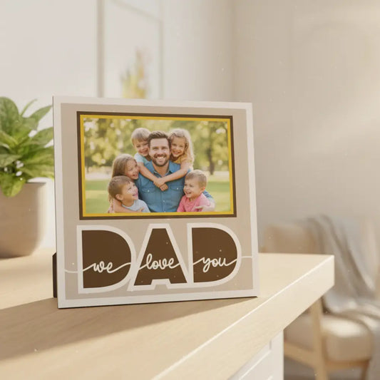 Decorative sign with 'DAD we love you' text on a beige background