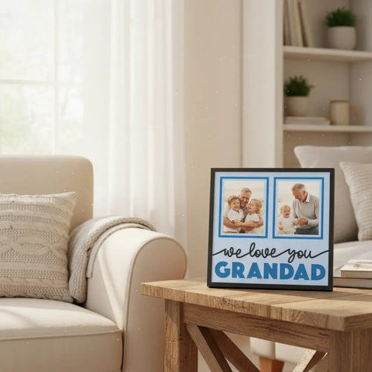 Decorative sign with 'we love you GRANDAD' text on a light blue background